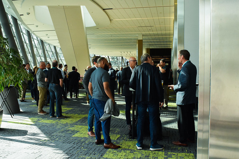 Guests gather and speak with one another.