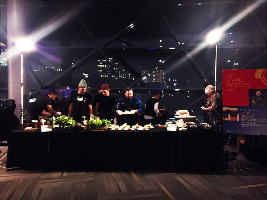 Marc Doiron and his team at table making food