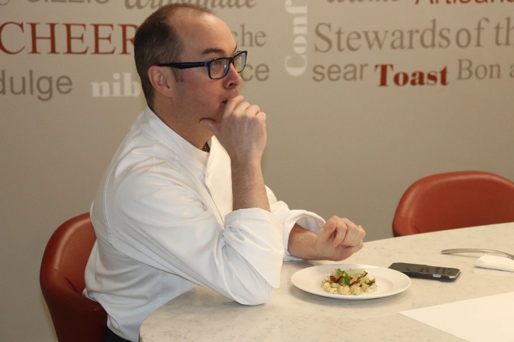 Chef Patrick Turcot with plate of food