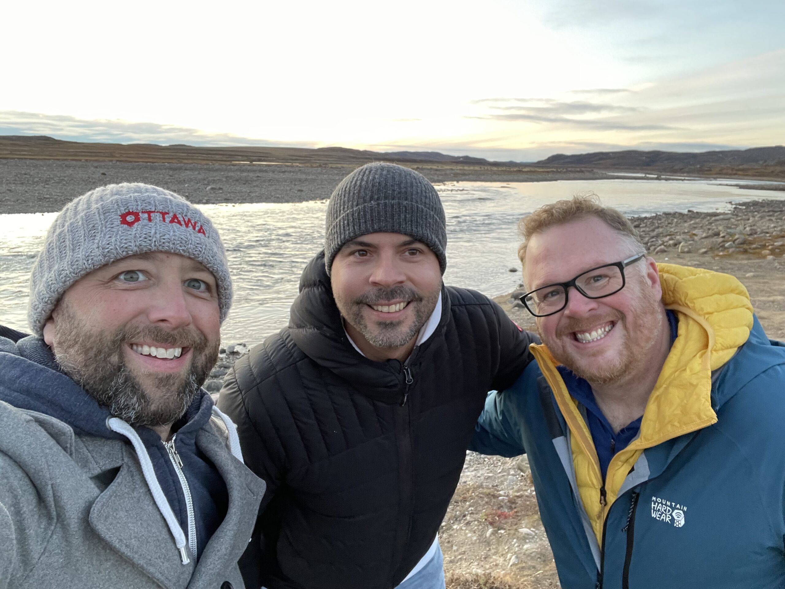 Matthew Blackburn and friends posing near a river