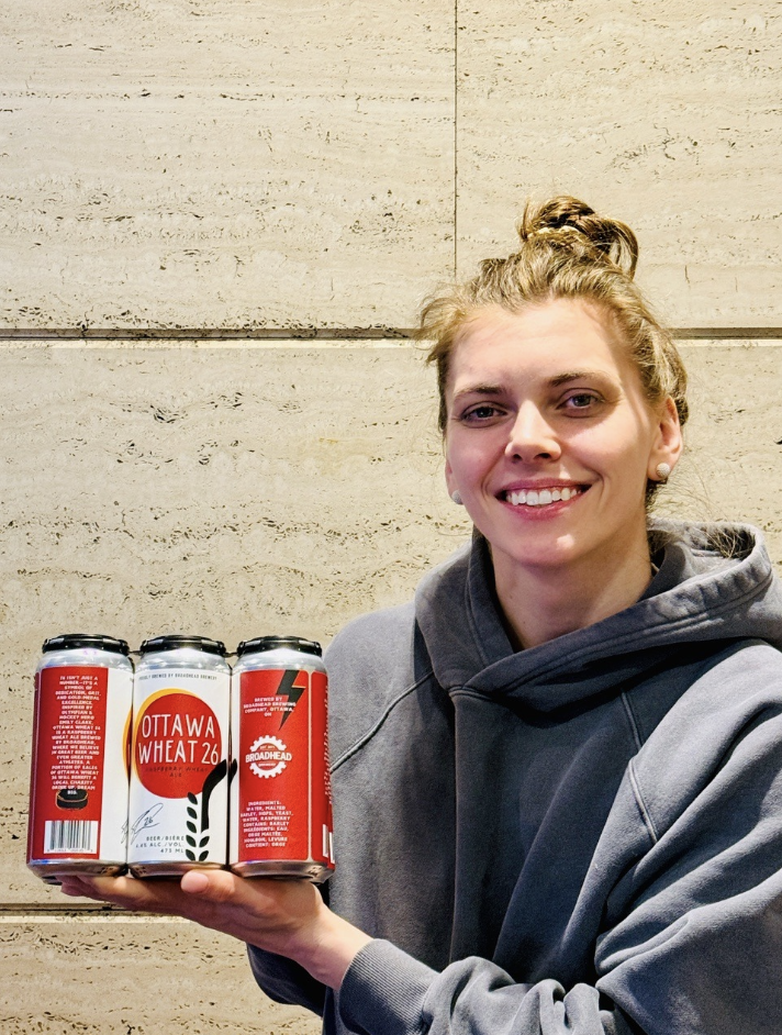 Person holding a case of beer