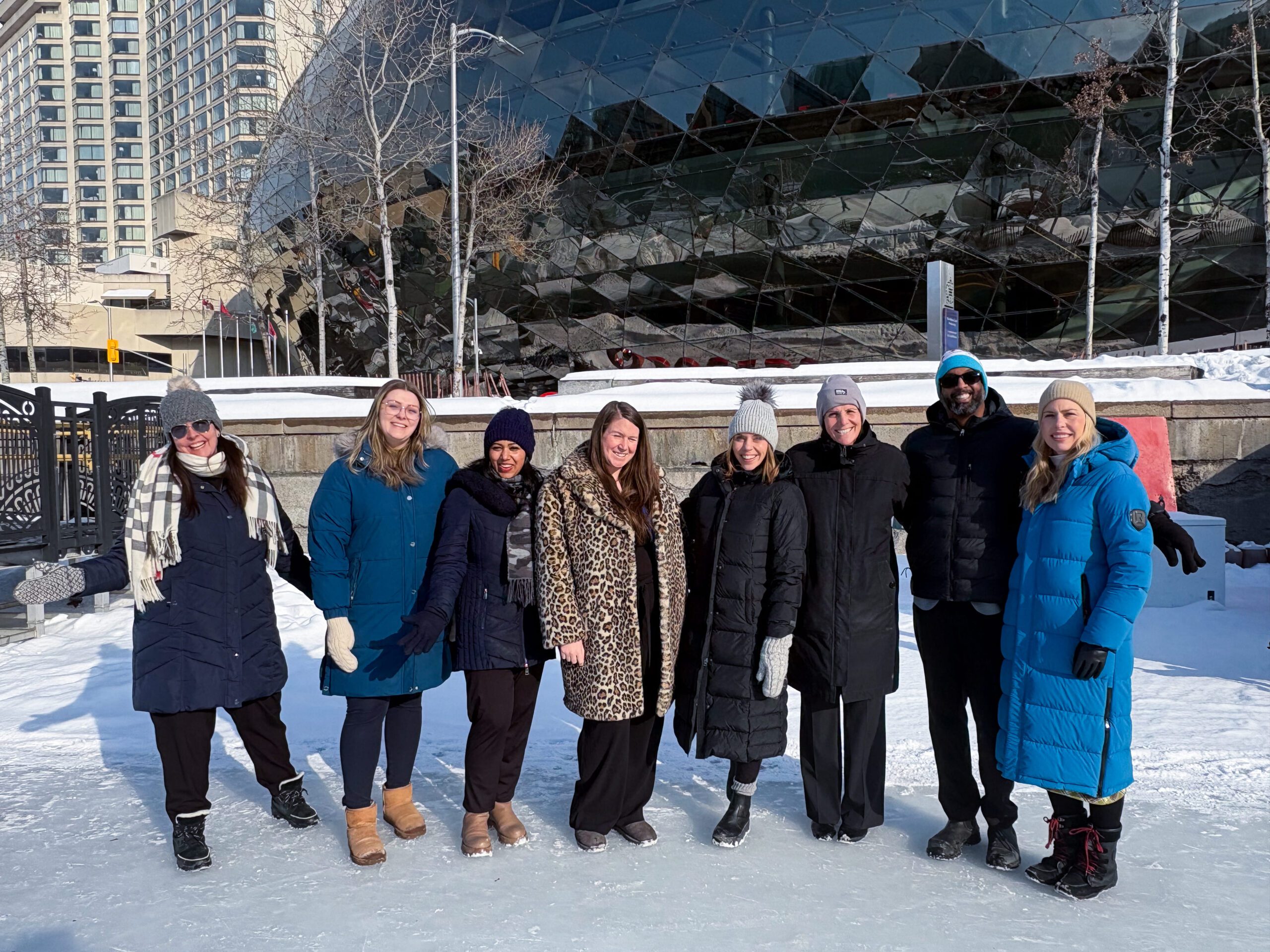 A group of people standing in front of the Rogers Centre
