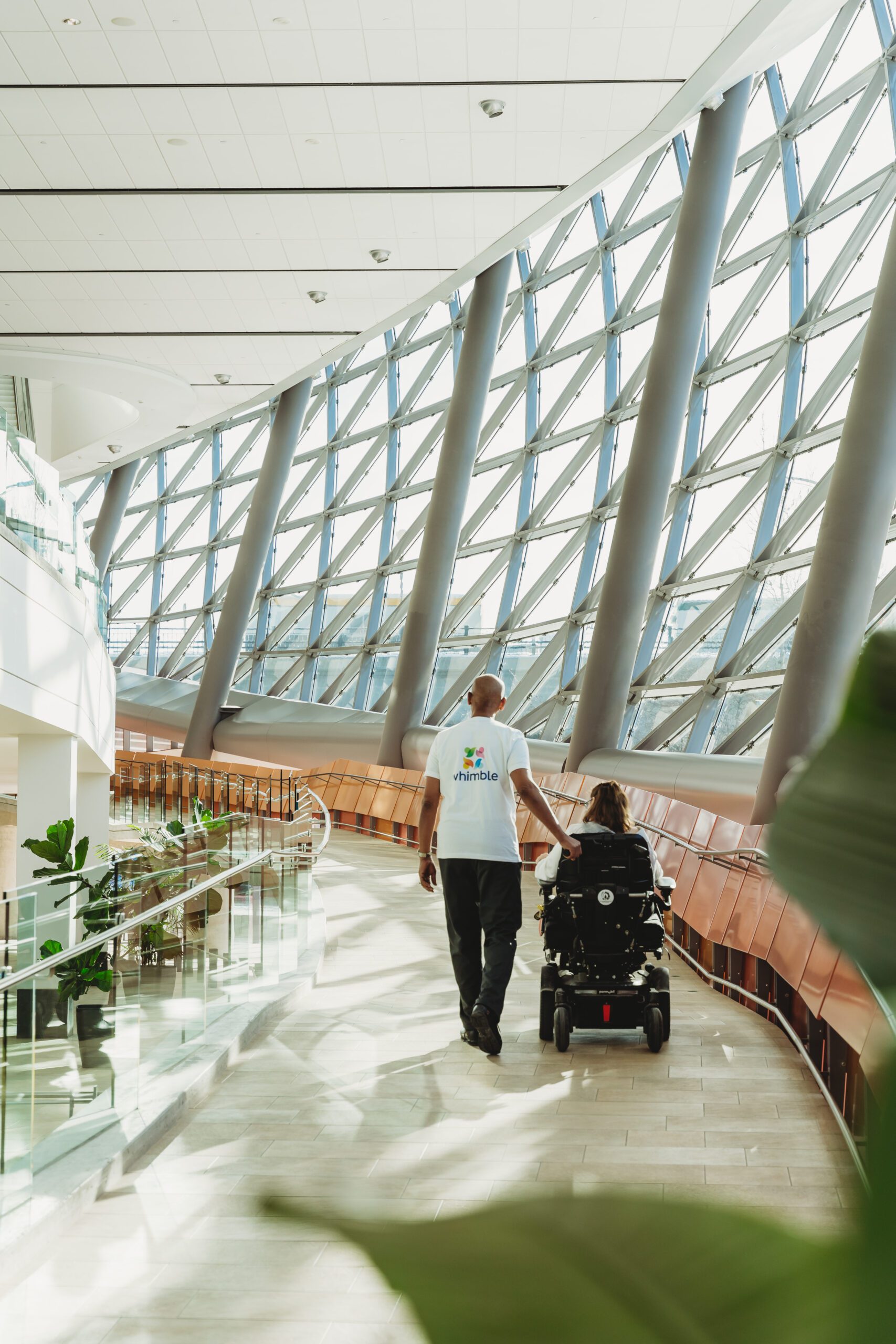 Whimble volunteer talking with an attendant of Whimble conference