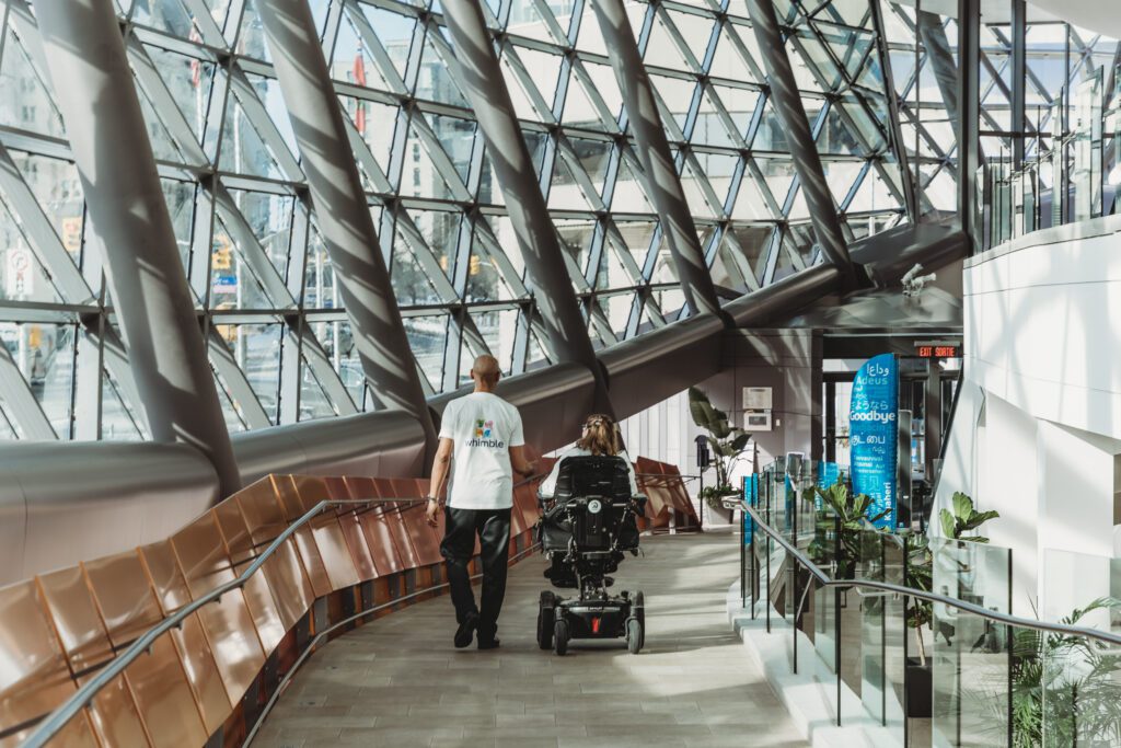 Whimble volunteer talking with an attendant of Whimble conference